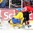 MALMO, SWEDEN - DECEMBER 26: Switzerland's Kevin Fiala #23 scores a first period goal against Sweden's Oscar Dansk #35 while Lucas Wallmark #28 defends during preliminary round action at the 2014 IIHF World Junior Championship. (Photo by Andre Ringuette/HHOF-IIHF Images)